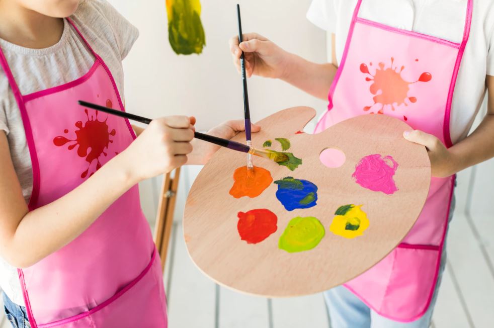 Two Girls Painting