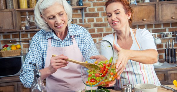 Mother and daughter cooking