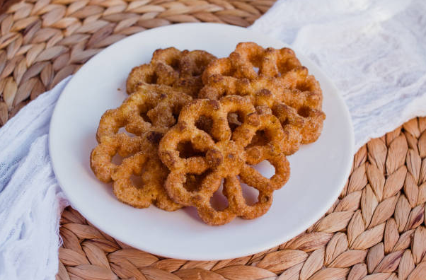 Buñuelos de viento on a white plate